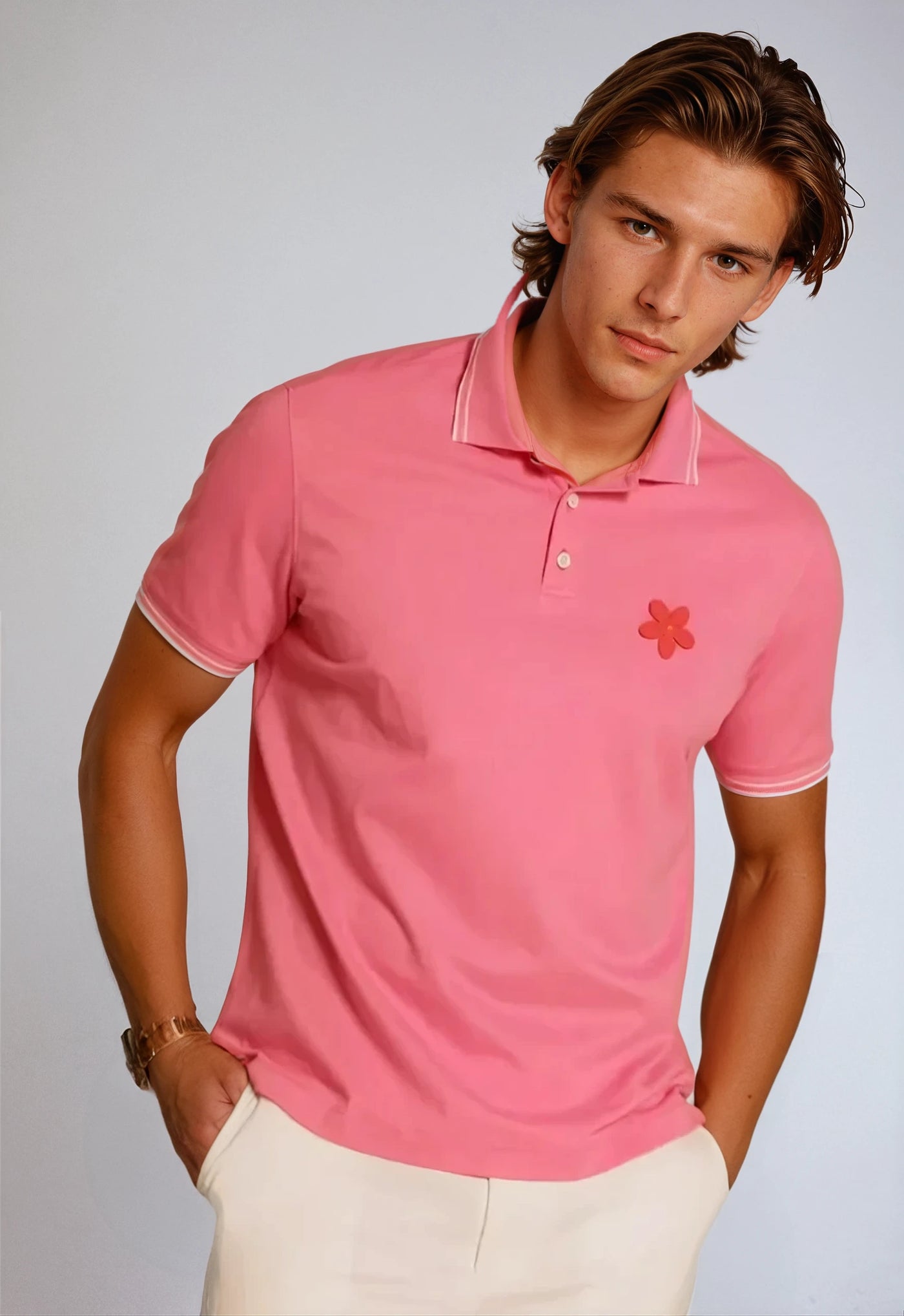 Made in Thailand, this Buki "happy" polo shirt features a "happy" flower motif on the chest. In Sunrise.