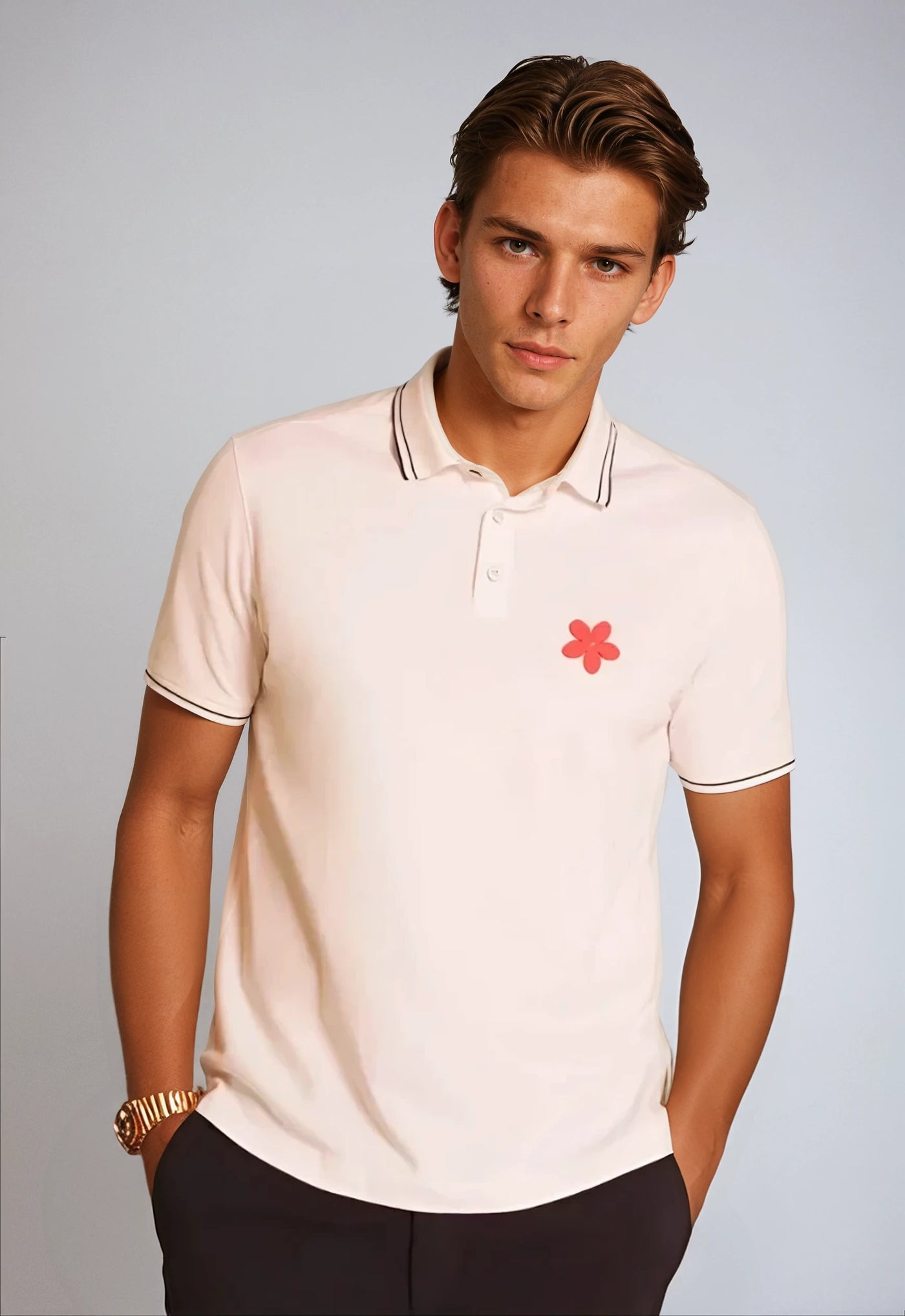 Made in Thailand, this Buki "happy" polo shirt features a "happy" flower motif on the chest. In White.